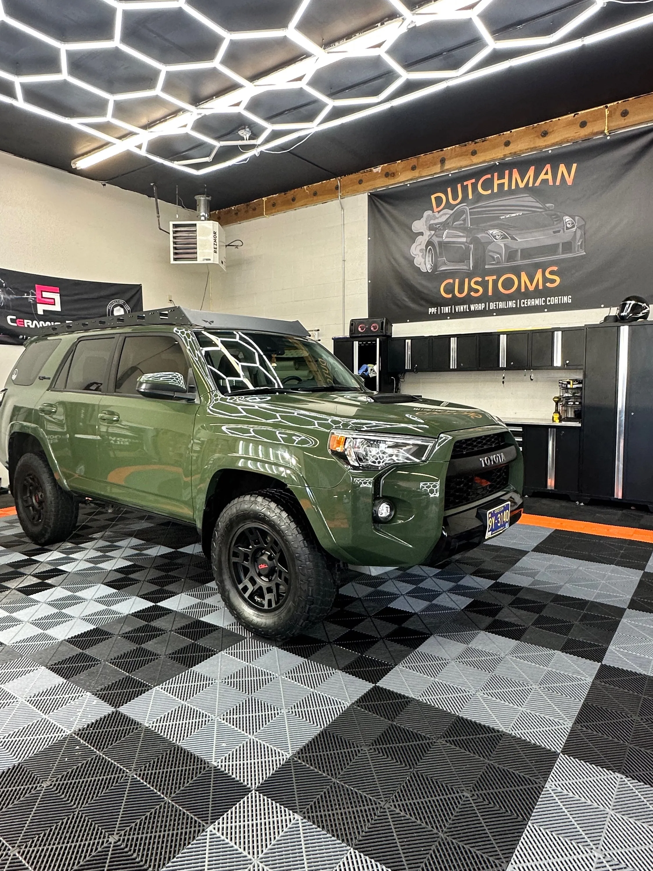 Army green Toyota 4Runner TRD Pro in the bay