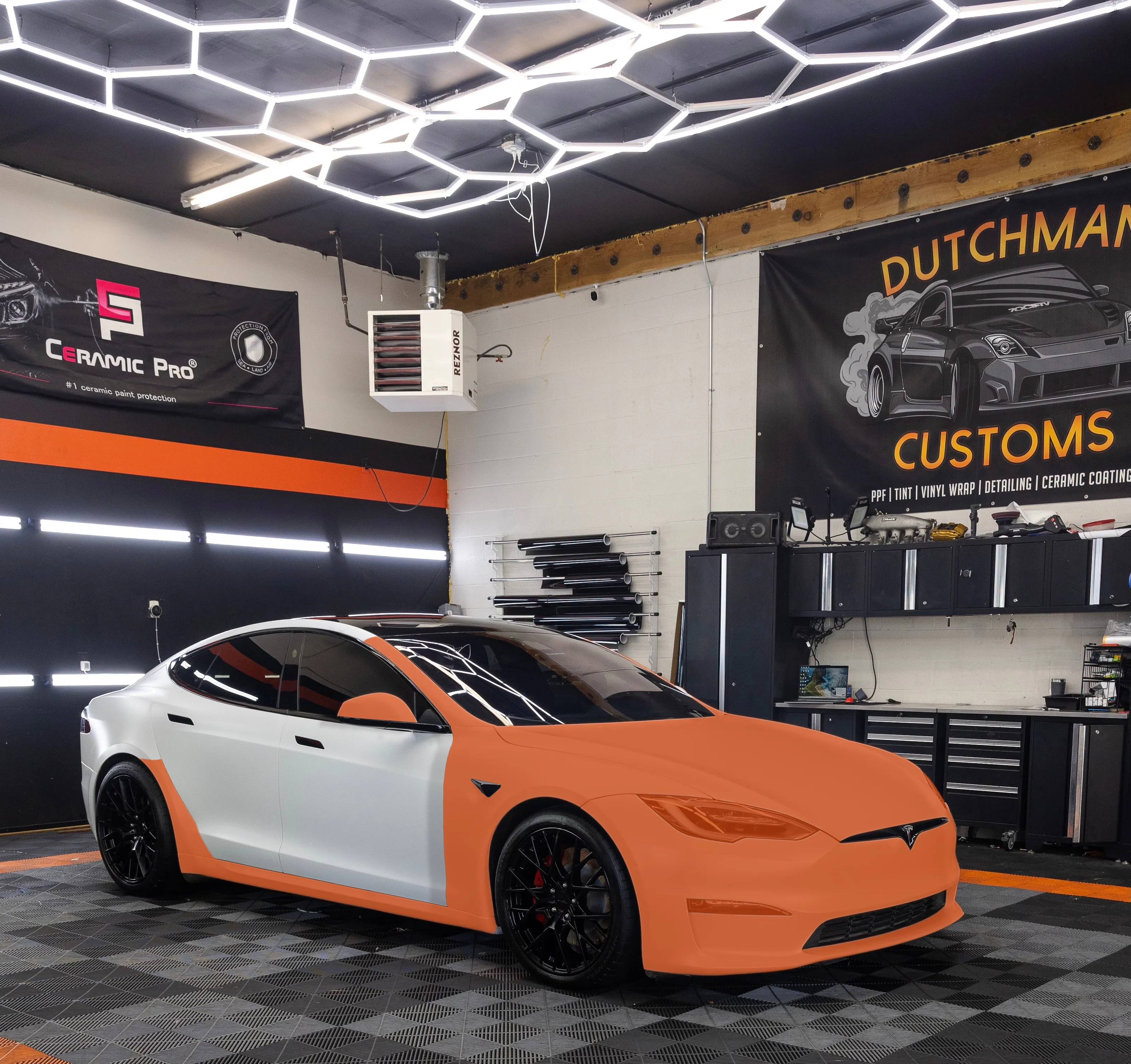 Tesla Model S showing full front PPF coverage in orange
